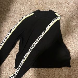 Black turtleneck sweater with side print